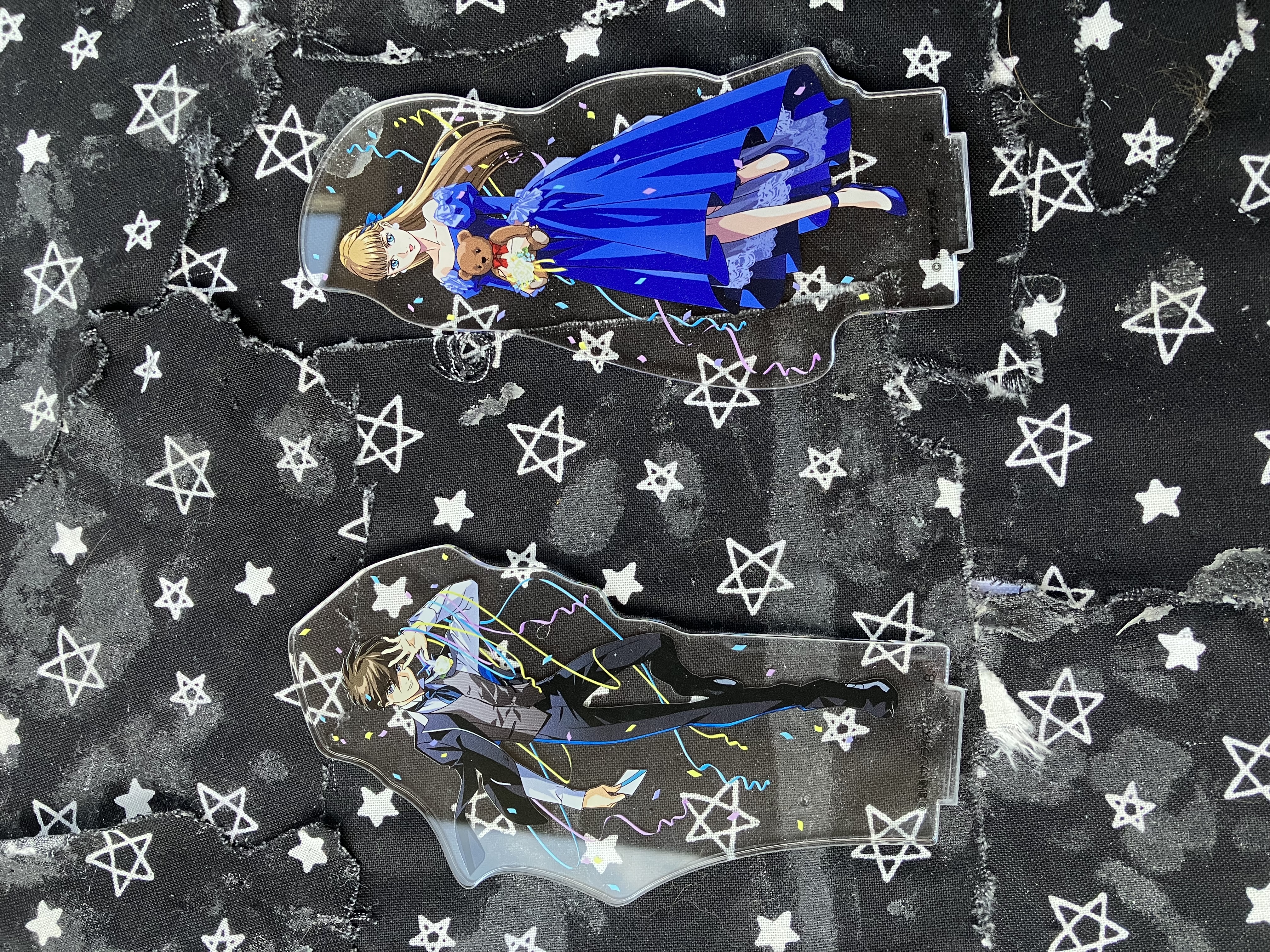 30th anniversary acrylic stands of Gundam wing Heero and Relena in formal attire.